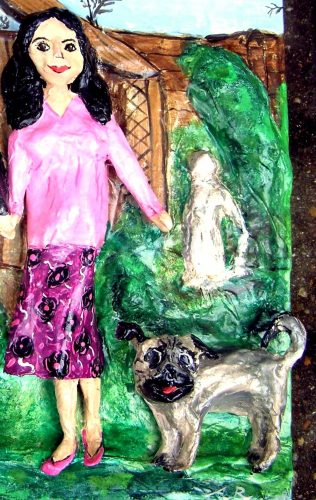 dog papier mache sculpture showing pug and owner